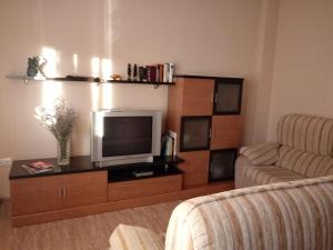 A television and/or entertainment centre at Casa Rural San Gines
