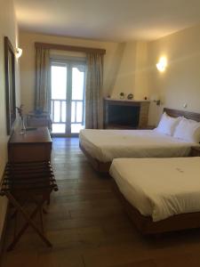 Ένα ή περισσότερα κρεβάτια σε δωμάτιο στο Olympios Zeus Hotel