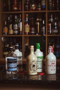 a group of different types of bottles on a counter at Bannockburn Inn in Helmsdale