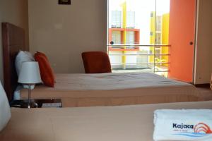 Postel nebo postele na pokoji v ubytování Kajaca Suite Hotel