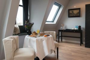 A restaurant or other place to eat at Canal House The Tannery Amsterdam