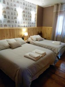 Ein Bett oder Betten in einem Zimmer der Unterkunft Casa Escosa