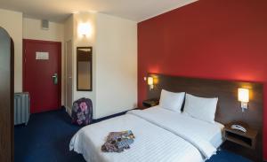 Postel nebo postele na pokoji v ubytování Dodo Hotel