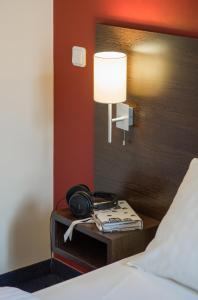 Postel nebo postele na pokoji v ubytování Dodo Hotel