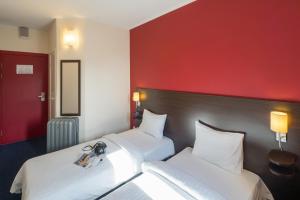 Postel nebo postele na pokoji v ubytování Dodo Hotel
