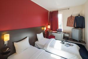 Postel nebo postele na pokoji v ubytování Dodo Hotel