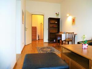 a living room with a table and a dining room at Charming, central, spacious apartment in Innsbruck