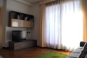 TV a/nebo společenská místnost v ubytování Bnbook - Residenza Naggi
