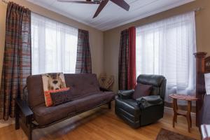 a living room with a couch and a chair at Acacias Bed & Breakfast in Quebec City