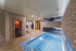 a large bathroom with a large tub in a room at Merotell in Krasnodar