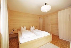 Postel nebo postele na pokoji v ubytování Gästehaus Meusburger
