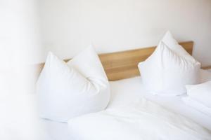 Postel nebo postele na pokoji v ubytování Gästehaus Meusburger