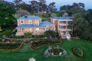 an aerial view of a house with a garden at Grand Mercure Basildene Manor in Margaret River Town