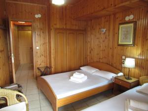 Postel nebo postele na pokoji v ubytování Balogiannis Hotel