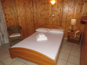 Postel nebo postele na pokoji v ubytování Balogiannis Hotel