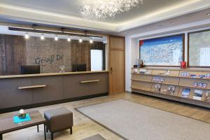 a lobby of a dental clinic with a waiting room at Hotel Alpenrose in Zauchensee