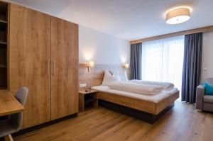 Posteľ alebo postele v izbe v ubytovaní St. Florian Appartements