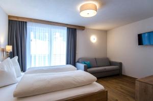 Posteľ alebo postele v izbe v ubytovaní St. Florian Appartements