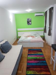 A bed or beds in a room at Apartmani Banja SPA