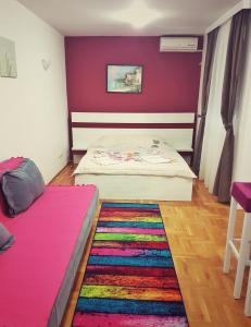 A bed or beds in a room at Apartmani Banja SPA