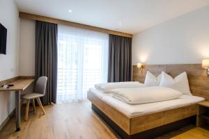Posteľ alebo postele v izbe v ubytovaní St. Florian Appartements