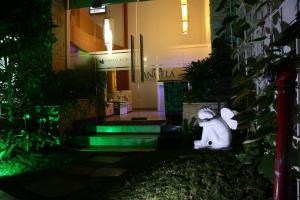 a statue of a rabbit sitting in front of a building at Angela Boutique Serviced Residence in Ho Chi Minh City