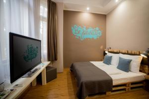 TV a/nebo společenská místnost v ubytování Hotel Carpe Diem