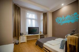 TV a/nebo společenská místnost v ubytování Hotel Carpe Diem