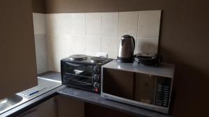 Køkken eller tekøkken på Let Us accomodation