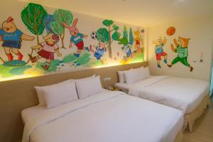 Postel nebo postele na pokoji v ubytování Legend Hotel Kaohsiung Liuhe