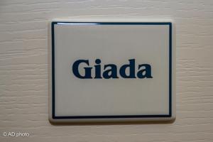 a sign for a gada on a wall at Homesuitehome in Rome
