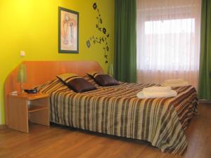 Postel nebo postele na pokoji v ubytování Hotel Gregor