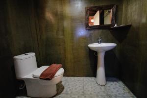 a bathroom with a sink and a toilet and a mirror at Ma der bua hotel in Udon Thani +20 photos