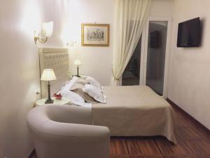 Postel nebo postele na pokoji v ubytování Locanda Navona
