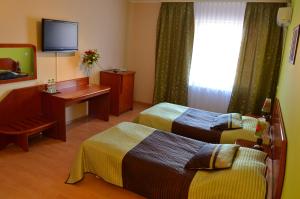 Postel nebo postele na pokoji v ubytování Hotel Gregor