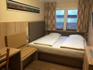 Tempat tidur dalam kamar di Schwedenhaus Wismar