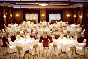 a banquet hall with white tables and chairs at InterContinental Almaty by IHG in Almaty +277 photos
