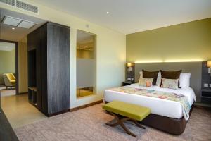 Katil atau katil-katil dalam bilik di Tamarind Tree Hotel