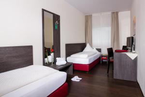 Postel nebo postele na pokoji v ubytování Hotel Bloemfontein