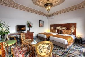 Postel nebo postele na pokoji v ubytování Riad El Amine Fès - Historic Hotels Worldwide
