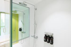 a shower with a glass door in a bathroom at Hotel Rec Barcelona - Adults Only in Barcelona