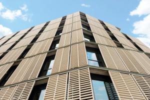 a tall building with window shutters on it at Hotel Rec Barcelona - Adults Only in Barcelona