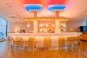 Телевизор и/или развлекательный центр в Park Hotel Latgola
