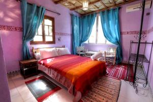 Postel nebo postele na pokoji v ubytování Kasbah Restaurant Amazir