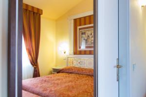 Katil atau katil-katil dalam bilik di Hotel Tuder