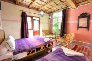 Postel nebo postele na pokoji v ubytování Kasbah Restaurant Amazir