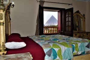 Postel nebo postele na pokoji v ubytování Pyramids Power Inn + 37 fotografií
