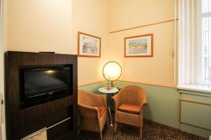 TV a/nebo společenská místnost v ubytování Hotel Sachsenhof