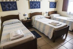 Letto o letti in una camera di Albergo Diffuso Il Mandorlo