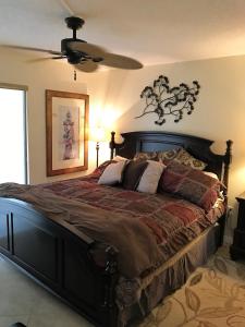 a bedroom with a large bed in a room at Crescent Arms 105N in Sarasota
